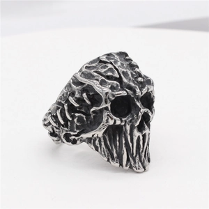 Vintage gothic mummy skull ring in oxidized titanium steel with punk style texture
