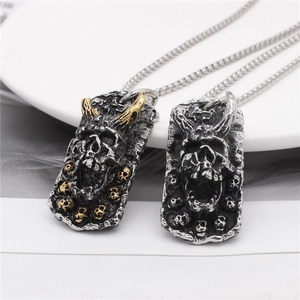 Gothic rectangular pendant with embossed ram horn skull design in gold and silver finish