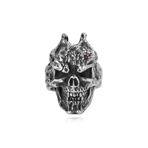 Close-up of vintage gothic skull ring with red zircon eye in aged silver finish