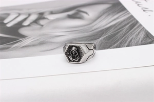 Macro shot of gothic grim reaper relief on hexagonal vintage stainless steel signet ring