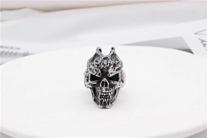 Macro detail of gothic skull ring with vintage texture and red gemstone eye inlay