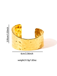 Detail view of gold hammered wide cuff bracelet with dimensions 3.95cm height and 51.9g weight