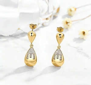 Detail shot of gold S925 sterling silver drop earrings with micro-inlaid zircon stones