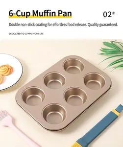 Close-up of champagne gold 6-cup muffin pan with non-stick coating on white marble