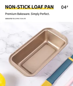 Close-up of champagne gold non-stick rectangular loaf pan on white marble surface