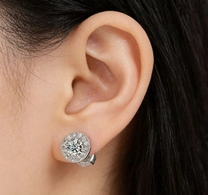 Close-up of S925 sterling silver halo stud earrings with brilliant zircon on a model