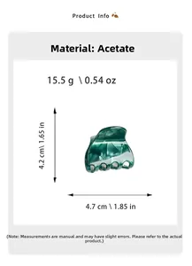 Detail view of small green marble acetate hair claw showing 4.7cm width and 15.5g weight