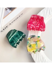 Detailed set of three colorful acetate hair claws featuring marble and floral patterns