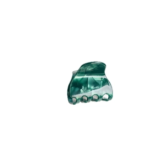 Emerald marble acetate shark hair claw clip for women with strong grip on white background