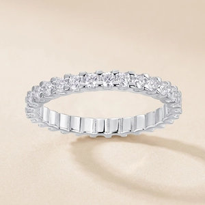 S925 sterling silver eternity ring featuring D color moissanite stones on neutral background