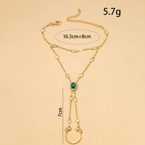 Vintage gold hand harness with green rhinestone and detailed size specifications