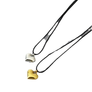Minimalist adjustable heart pendant necklace set in polished gold and silver finishes