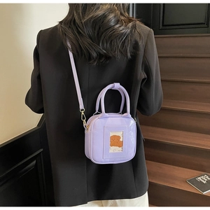 Detail of lavender PU leather square bag with cartoon card slot and detachable strap