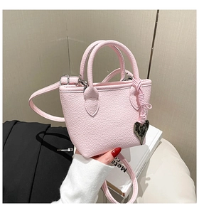 Pink litchi texture leather mini bag with metal heart pendant and slender strap
