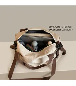 Large canvas tote bag with spacious striped interior holding a laptop and daily essentials