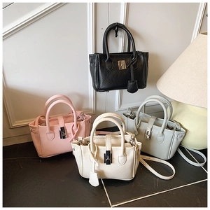 Macro detail of leather bucket bags in four colors with premium silver metal hardware