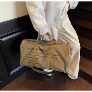 Detailed view of khaki canvas travel tote with leather handles and Vigor Vivid print