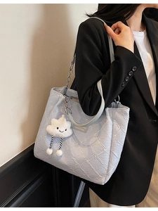 Light blue floral embossed tote bag with cloud charm and silver chain strap