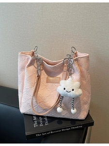 Pink floral jacquard tote bag with silver chain strap and white plush cloud charm