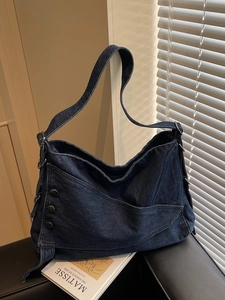 Retro deep blue denim hobo bag with vintage metal buckles and spacious design