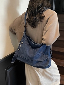Retro denim tote bag for women featuring asymmetric flap and metal ring buckle design