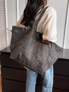 Large leopard print canvas tote bag with outer pocket and rivet detail for women