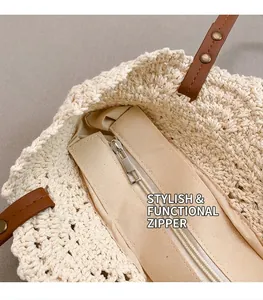 Détail du sac cabas tissé avec doublure en tissu beige et fermeture éclair en métal argenté