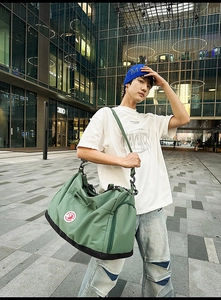 Macro detail of large nylon tote bag with brand logo and multifunctional side zipper pocket