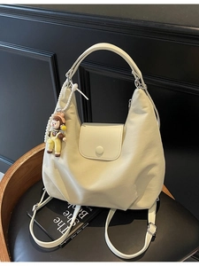 Cream white canvas hobo tote bag with cartoon doll pendant and pearl chain