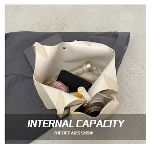 Large capacity beige tote bag showing spacious interior with personal essentials
