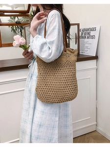 Chic woven hollow tote bag with leather straps for summer beach vacations and daily use