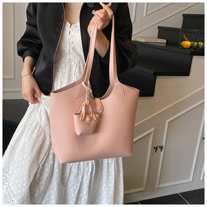 Pink lychee grain leather tote bag with decorative mini pouch and spacious interior