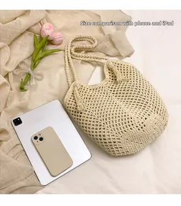 Detailed size comparison of hollow straw tote bag with iPad and smartphone