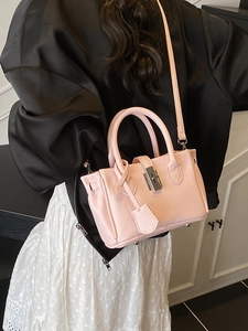 Pink lychee texture leather bucket bag with silver buckle and adjustable shoulder strap
