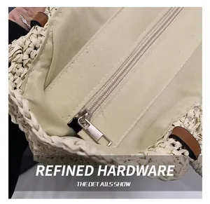 Close-up of premium silver metal zipper and durable canvas lining inside the straw bag