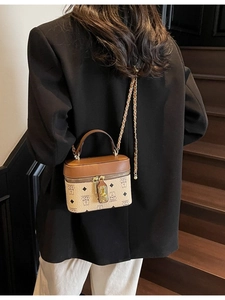 Brown box-shaped crossbody bucket bag with bear print and golden chain handle
