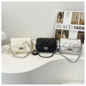 Quilted flap square bags in white, black and silver with chain straps and metal locks