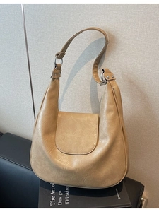 Retro khaki hobo shoulder bag with silver metal ring details and adjustable strap