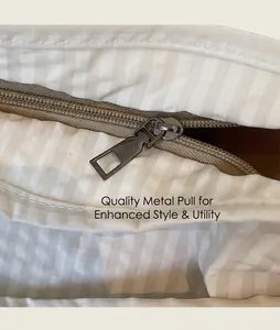 Close-up of durable metal zipper puller on minimalist plaid canvas tote bag