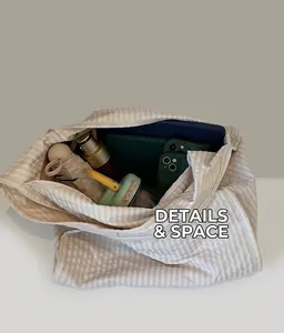 Top view of large striped canvas tote bag showing interior space for tablet and umbrella