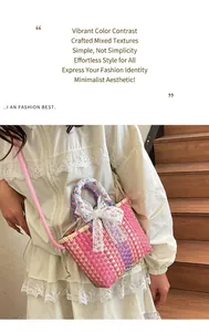 Detailed view of handmade woven crossbody bag with lace bow and colorful weave design