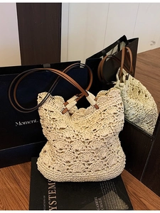 Handmade woven straw bucket bag with leather handles and hollow floral crochet texture