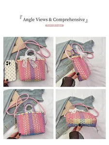Detail of woven mini crossbody bag featuring pink blue texture and white lace bow
