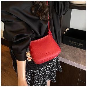 Red lychee pattern crossbody bucket bag with fashion text and cute rabbit pendant