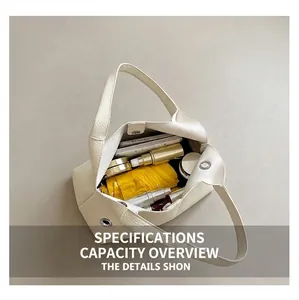 Top view of large capacity cream white tote bag showing umbrella and phone interior storage