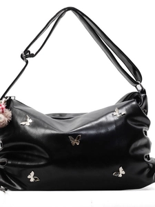 Glossy black pleated crossbody bag with silver butterfly charms and plush keychain