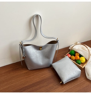 Silver lychee textured bucket bag set with inner zipper pouch and heart pendant detail