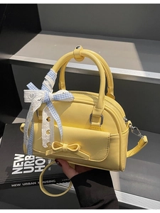 Yellow mini barrel bag with bow detail and lace ribbon for women's casual crossbody style