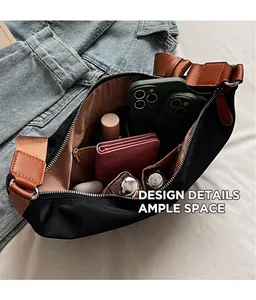 Detail view of black oxford crossbody bag interior with large capacity and multi-pocket layout
