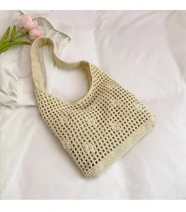 Detail of hand-woven beige tote bag with intricate mesh pattern and cotton lining